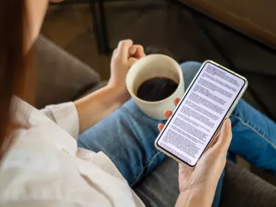 woman hand holding coffee cup and phone, reading text on mobile screen for digital press article feed in the morning. mockup media publication website in smartphone.