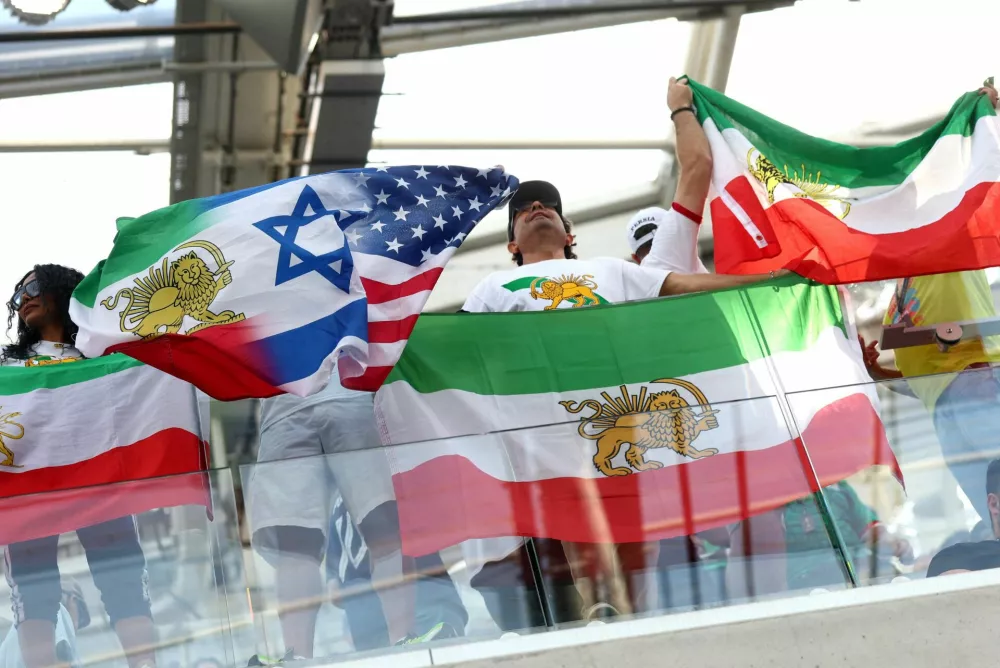 Soccer Football - FIFA World Cup 2026 - Group G - Iran v New Zealand - Los Angeles Stadium, Inglewood, California, U.S. - June 15, 2026 Iran fans display a combined pre-Iranian Revolution "Lion and Sun", Israel and United States flag inside the stadium before the match REUTERS/Lisi Niesner   TPX IMAGES OF THE DAY