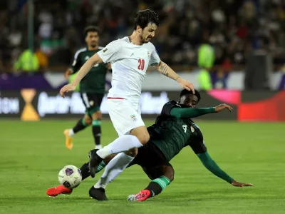 FILE PHOTO: Soccer Football - World Cup - AFC Qualifiers - Third Round - Group A - Iran v United Arab Emirates - Azadi Sports Complex, Tehran, Iran - March 20, 2025 Iran's Sardar Azmoun in action with United Arab Emirates' Kouame Kouadio Majid Asgaripour/WANA (West Asia News Agency) via REUTERS  ATTENTION EDITORS - THIS IMAGE HAS BEEN SUPPLIED BY A THIRD PARTY./File Photo
