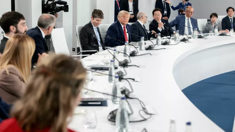 U.S. President Donald Trump, OpenAI CEO Sam Altman, Google DeepMind CEO Demis Hassabis, South Korea's President Lee Jae Myung, Germany's Chancellor Friedrich Merz and Japan's Prime Minister Sanae Takaichi attend a working lunch with G7 leaders, G7 outreach partners and global tech CEOs on innovation and AI during the G7 Summit in Evian-les-Bains, France, June 17, 2026.REUTERS/Evelyn Hockstein REFILE - ADDING INFORMATION