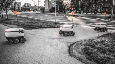 Some Delivery robots on the street. Estonian Cyber-couriers in Tallinn city. Sunny summer day. Copy space. Fitered image. the concept of new technology.