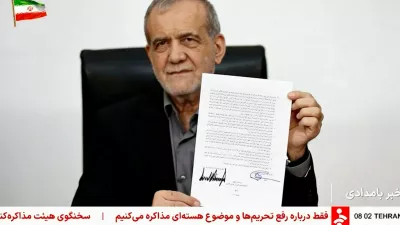 A screen grab shows Iran's President Masoud Pezeshkian holding a memorandum signed with U.S. President Donald Trump in Tehran, Iran, June 18, 2026, taken from a video. Pool via WANA/Reuters TV/Handout via REUTERS  THIS IMAGE HAS BEEN SUPPLIED BY A THIRD PARTY. ISRAEL OUT. NO COMMERCIAL OR EDITORIAL SALES IN ISRAEL. NO USE BBC PERSIAN. NO USE VOA PERSIAN. NO USE MANOTO. NO USE IRAN INTERNATIONAL. NO USE RADIO FARDA, NO USE ISRAEL. FOR REUTERS CUSTOMERS ONLY. OVERLAYS FROM SOURCE.