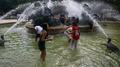 Young people cool off in the Fontaine de l'Observatoire fountain as temperatures rise in Paris and a heatwave hits a large part of France, June 18, 2026. REUTERS/Abdul Saboor