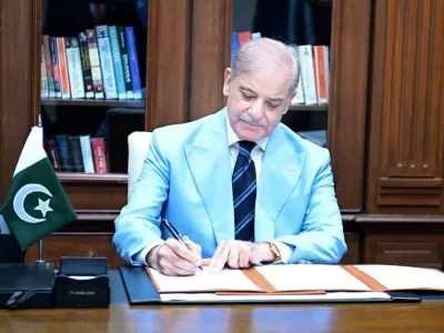 Pakistan's Prime Minister Shehbaz Sharif signed Islamabad Memorandum of Understanding (Islamabad MoU) as mediator, after it was signed by U.S. President Donald J. Trump and Iranian President Masoud Pezeshkian, at his office in Islamabad, Pakistan, June 18, 2026. Press Information Department (PID)/Handout via REUTERS ATTENTION EDITORS - THIS PICTURE WAS PROVIDED BY A THIRD PARTY. BEST QUALITY AVAILABLE.    TPX IMAGES OF THE DAY
