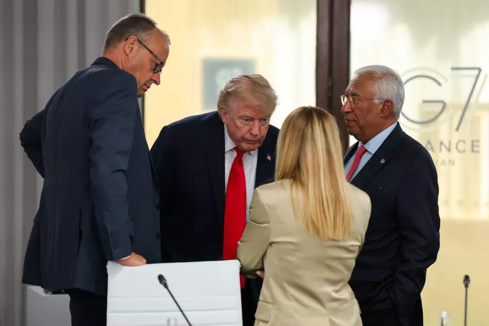 President Donald Trump, Germany's Chancellor Friedrich Merz, European Council President Antonio Costa and Italy's Prime Minister Giorgia Meloni attend a working lunch with leaders of G7 and the Middle East in Evian-les-Bains, France, Tuesday, June 16, 2026. (Christian Hartmann/Pool Photo via AP)