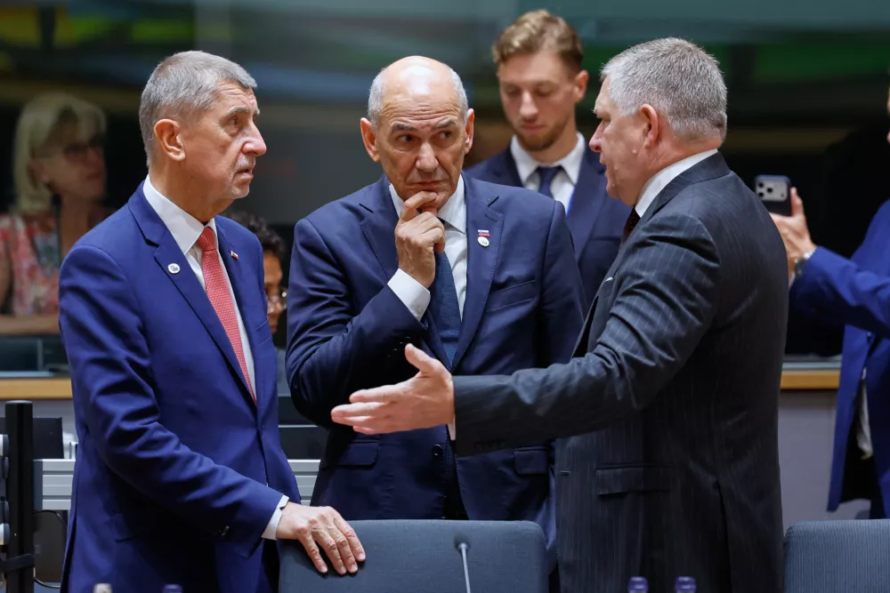 From right, Slovakia's Prime Minister Robert Fico, Slovenia's Prime Minister Janez Jansa and Czech Republic's Prime Minister Andrej Babis talk during a round table meeting at the EU summit in Brussels, Friday, June 19, 2026. (AP Photo/Geert Vanden Wijngaert)