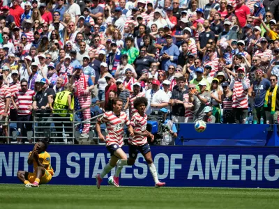 Australia's Nestory Irankunda fans to the ground after being fouled during the World Cup Group D soccer match between the United States and Australia in Seattle, Friday, June 19, 2026. (AP Photo/Lindsey Wasson)