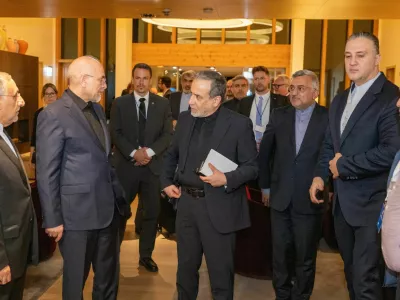 Iranian Foreign Minister Seyyed Abbas Araghchi, center, and Speaker of the Islamic Parliament of Iran Mohammed Bagher Ghalibaf, left, arrive at the Buergenstock resort in Obbuergen, near Lucerne, Switzerland, early Sunday, June 21, 2026. (Urs Flueeler/Keystone, Pool via AP)