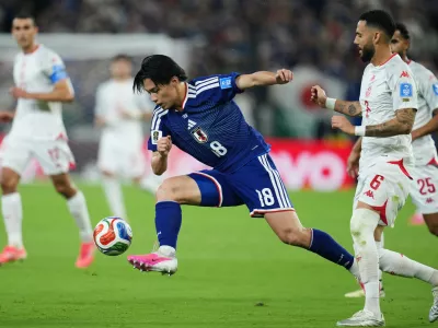 Japan's Ayase Ueda controls the ball during the World Cup Group F soccer match against Tunisia in Guadalupe, near Monterrey, Mexico, Saturday, June 20, 2026. (AP Photo/Matias Delacroix) CORRECTION: Corrects player at center to Japan's Ayase Ueda (18), instead of Takefusa Kubo.