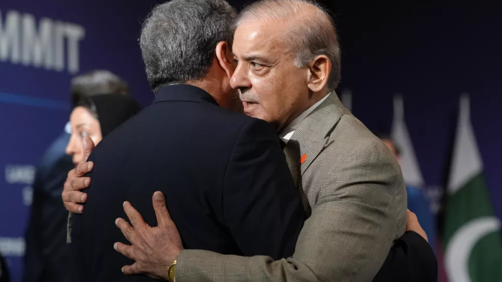 Iran's Foreign Minister Abbas&nbsp;Araqchi, left,&nbsp;and Pakistan's Prime Minister Shehbaz Sharif greet each other before the start of a quadrilateral meeting between the U.S., Iran, Pakistan, and Qatar, at the B&uuml;rgenstock Resort in Obbuergen, Switzerland, Sunday, June 21, 2026. (Nathan Howard/Pool Photo via AP)