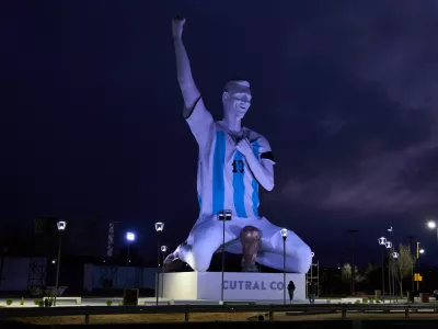 A sculpture of soccer star Lionel Messi by artist Aldo Beroisa, that was unveiled for Argentina's opening World Cup match against Algeria, stands in Cutral Co, Argentina, at sunrise Sunday, June 21, 2026. (AP Photo/Nestor Ponce)