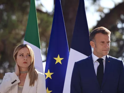 Italian Prime Minister Giorgia Meloni, left, attends a joint press conference with French President Emmanuel Macron, right, as part of a Franco-Italian summit in Antibes, southern France, Thursday, June 25, 2026. (Manon Cruz/Pool Photo via AP)