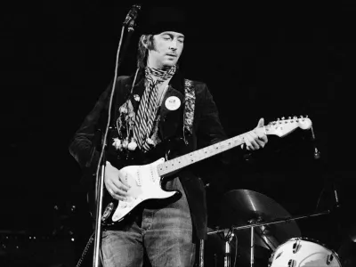 COPENHAGEN, DENMARK - JUNE 20: Eric Clapton performs on stage at the KB Hallen on June 20th 1974 in Copenhagen, Denmark. He plays his Fender Stratocaster guitar 'Blackie'. (Photo by Jorgen Angel/Redferns)