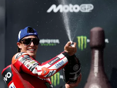 FILE PHOTO: MotoGP - Czech Republic Grand Prix - Masaryk Circuit, Brno, Czech Republic - June 21, 2026 Ducati Lenovo Team's Marc Marquez sprays champagne out of the bottle after winning the race REUTERS/David W Cerny/File Photo