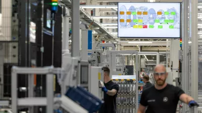 FILE PHOTO: Worker assemble axial-flux motors for electric vehicles on an assembly line at the Mercedes-Benz engine factory in Berlin, Germany June 9, 2026. REUTERS/Axel Schmidt/File Photo