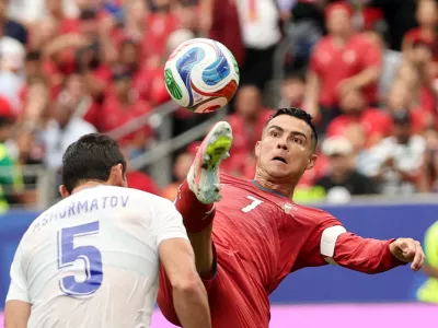 Soccer Football - FIFA World Cup 2026 - Group K - Portugal v Uzbekistan - Houston Stadium, Houston, Texas, U.S. - June 23, 2026 Portugal's Cristiano Ronaldo in action with Uzbekistan's Rustam Ashurmatov REUTERS/Phil Noble