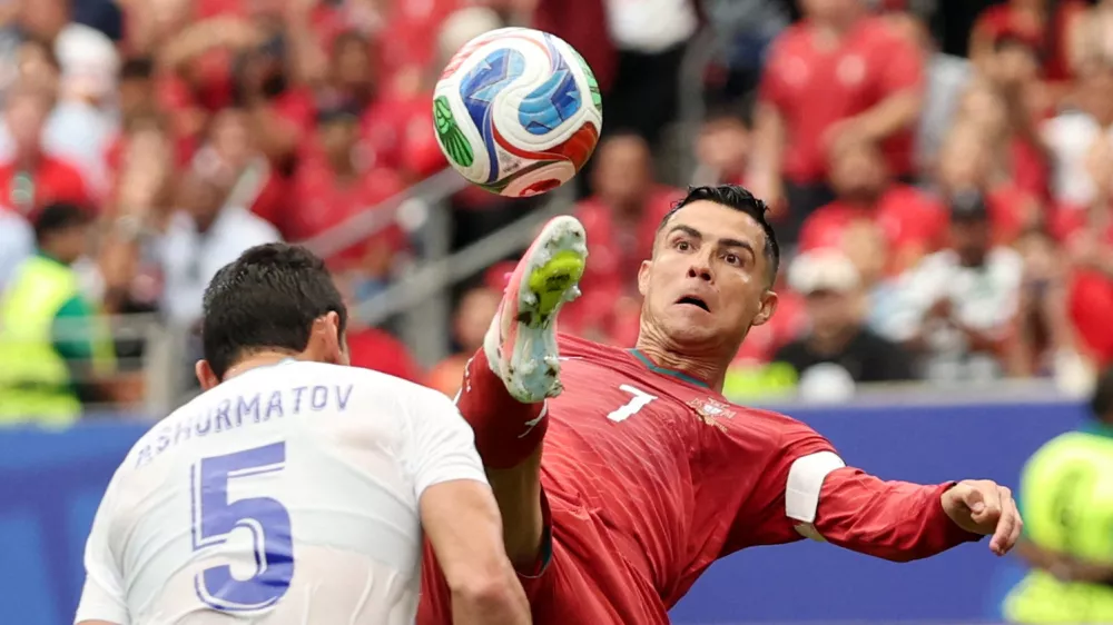Soccer Football - FIFA World Cup 2026 - Group K - Portugal v Uzbekistan - Houston Stadium, Houston, Texas, U.S. - June 23, 2026 Portugal's Cristiano Ronaldo in action with Uzbekistan's Rustam Ashurmatov REUTERS/Phil Noble