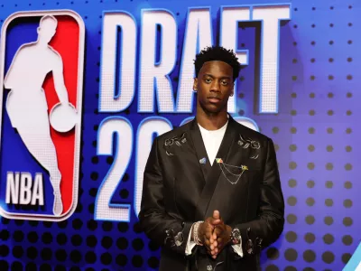AJ Dybantsa arrives for the first round of the NBA basketball draft Tuesday, June 23, 2026, in New York. (AP Photo/Adam Hunger)