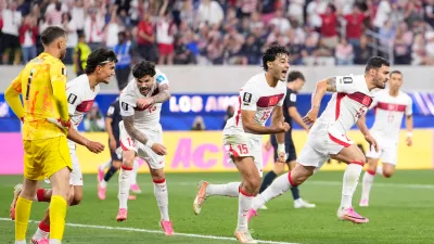 Turkey's Kaan Ayhan, right, celebrates scoring his side's third goal against the United States during a World Cup Group D soccer match in Inglewood, Calif., near Los Angeles, Thursday, June 25, 2026. (AP Photo/Mark J. Terrill)