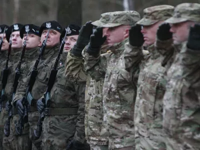In this file photo taken Jan. 12, 2017, U.S. Army vehicles are crossing the Polish border in Olszyna, Poland, heading for their new base in Zagan. U.S. troops deployed to Zagan in western Poland in 2017 as part of deterrence force of some 1,000 troops to reassure Poland that is worried about Russia's activity.(AP Photo/Czarek Sokolowski)