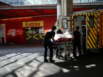 French firefighters arrive with a patient on a stretcher at the Emergency Department of the ​​Nantes CHU Hospital in Nantes, France, June 26, 2026. REUTERS/Stephane Mahe