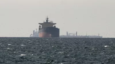FILE PHOTO: FILE PHOTO: Cargo ships in the Gulf, near the Strait of Hormuz, as seen from northern Ras al-Khaimah, near the border with Oman's Musandam governance, amid the U.S.-Israeli conflict with Iran, in United Arab Emirates, March 11, 2026. REUTERS/Stringer/File Photo