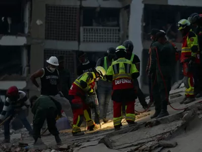 Rescue personnel assist in rescue efforts after earthquakes hit the country, in La Guaira, Venezuela, June 27, 2026. REUTERS/Maxwell Briceno