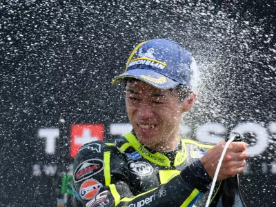 Japan's rider Ai Ogura of the Trackhouse MotoGP Team celebrates after winning the MotoGP race at the Grand Prix of the Netherlands in Assen, northern Netherlands, Sunday, June 28, 2026. (AP Photo/Patrick Post)