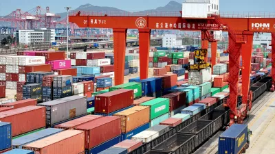 FILE PHOTO: Cargos are uploaded onto a China-Europe freight train at the China-Kazakhstan (Lianyungang) Logistics Cooperation Base in Lianyungang, Jiangsu province, China April 10, 2025. China Daily via REUTERS ATTENTION EDITORS - THIS IMAGE WAS PROVIDED BY A THIRD PARTY. CHINA OUT. NO COMMERCIAL OR EDITORIAL SALES IN CHINA./File Photo