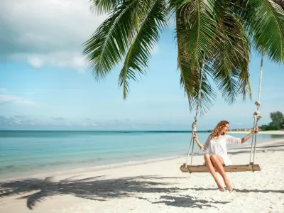 Beautiful Woman Swinging on a Tropical Beach,Image: 306318104, License: Royalty-free, Restrictions:, Model Release: yes 