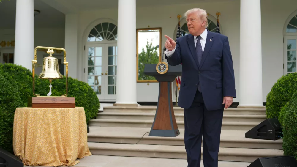 President Donald Trump speaks alongside the New York Stock Exchange bell in the White House Rose Garden, Monday, July 6, 2026, in Washington. (AP Photo/Julia Demaree Nikhinson)