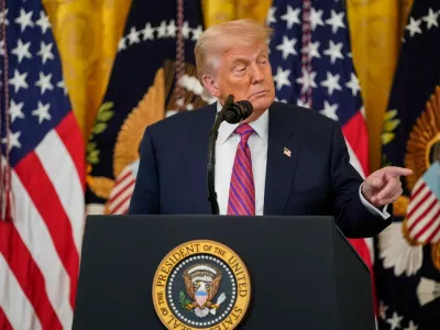 FILE PHOTO: U.S. President Donald Trump speaks before signing the "Genius Act", which will develop regulatory framework for stablecoin cryptocurrencies and expand oversight of the industry, at the White House in Washington, D.C., U.S., July 18, 2025. REUTERS/Nathan Howard/File Photo