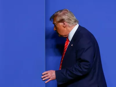 FILE PHOTO: U.S. President Donald Trump leaves a press conference at a NATO summit in The Hague, Netherlands June 25, 2025. REUTERS/Yves Herman/File Photo