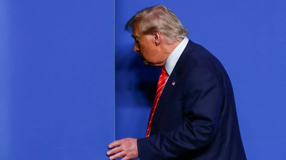 FILE PHOTO: U.S. President Donald Trump leaves a press conference at a NATO summit in The Hague, Netherlands June 25, 2025. REUTERS/Yves Herman/File Photo