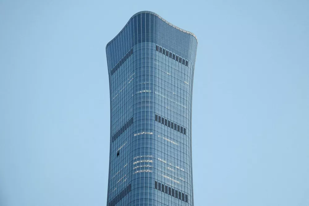 FILE PHOTO: The CITIC Tower, also known as China Zun, where damage is visible on a high floor of the exterior, in Beijing, China June 26, 2026. REUTERS/Maxim Shemetov/File Photo