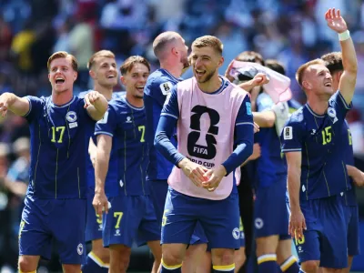 Soccer Football - FIFA World Cup 2026 - Group B - Bosnia and Herzegovina v Qatar - Seattle Stadium, Seattle, Washington, U.S. - June 24, 2026 Bosnia and Herzegovina's Dzenis Burnic, Amar Memic and Jovo Lukic celebrate after the match IMAGN IMAGES via Reuters/Blake Dahlin