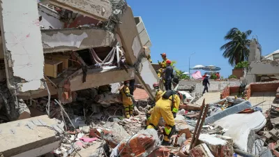 Rescuers work at the site of a collapsed building, in the aftermath of earthquakes, near Playa Los Corales, in La Guaira, Venezuela, July 1, 2026. REUTERS/Ricardo Arduengo