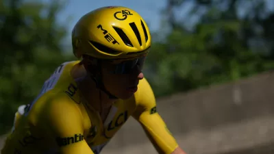 Slovenia's Tadej Pogacar, wearing the overall leader's yellow jersey, rides in the pack, during the fourth stage of the Tour de France cycling race over 181.9 kilometers (112.4 miles) with start in Carcassonne and finish in Foix, France, Tuesday, July 7, 2026. (AP Photo/Thibault Camus)