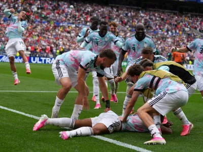 Belgian players celebrate after the thrid goal during the World Cup round of 32 soccer match between Belgium and Senegal in Seattle, Wednesday, July 1, 2026. (AP Photo/Manu Fernandez)