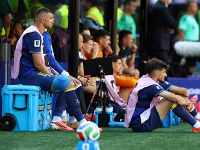 Soccer Football - FIFA World Cup 2026 - Round of 32 - United States v Bosnia and Herzegovina - San Francisco Bay Area Stadium, Santa Clara, California, U.S. - July 1, 2026 Bosnia and Herzegovina's Edin Dzeko sits with ice on his leg after being substituted REUTERS/Phil Noble
