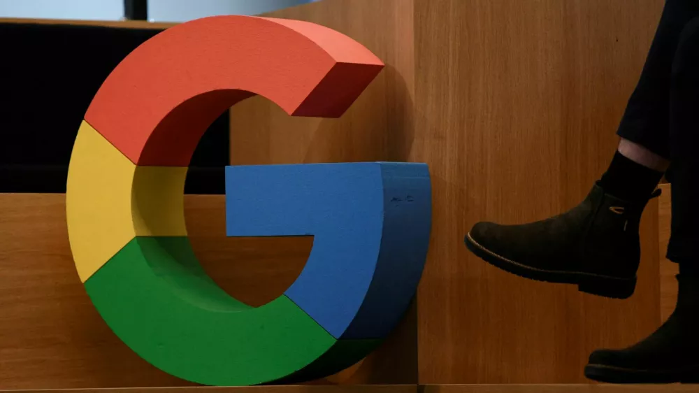 FILE PHOTO: A Google sign is pictured during the company's presentation of a detailed investment plan for Germany outside the Google office in Berlin, Germany, August 31, 2021. REUTERS/Annegret Hilse/File Photo
