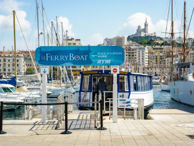Marseille, France - May 17, 2018: The Ferry Boat, a public maritime shuttle run today by the RTM, allows to cross the Old Port of Marseille since 1880, under the protection of Notre-Dame de la Garde.
