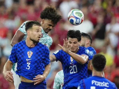 Soccer Football - FIFA World Cup 2026 - Round of 32 - Portugal v Croatia - Toronto Stadium, Toronto, Canada - July 2, 2026 Croatia's Marin Pongracic and Croatia's Igor Matanovic in action with Portugal's Renato Veiga IMAGN IMAGES via Reuters/Kevin Sousa