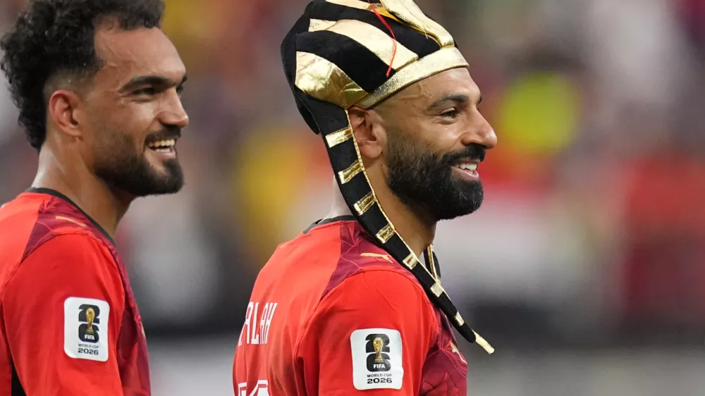 Egypt's Mohamed Salah, right, and teammate Mostafa Zico celebrate after winning a penalty shootout against Australia following a World Cup round of 32 soccer match in Arlington, Texas, near Dallas, Friday, July 3, 2026. (AP Photo/Julio Cortez)