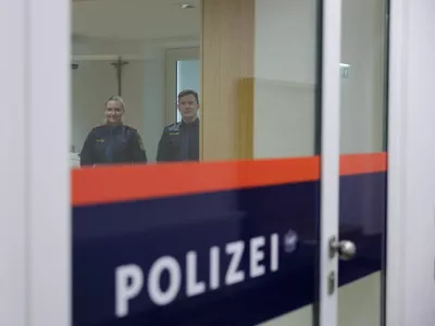 Police officers stand inside the building where Adolf Hitler was born, which has been converted into a police station by Austria's government in hopes of preventing it from serving as a place of pilgrimage for neo-Nazis, in Braunau am Inn, Austria, July 22, 2026. REUTERS/Gintare Karpaviciute