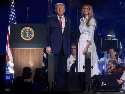 U.S. President Donald Trump and U.S. first lady Melania Trump stand onstage together after his remarks at a Fourth of July rally, marking the 250th anniversary of U.S. independence, on the National Mall in Washington, D.C., U.S., July 4, 2026. REUTERS/Jonathan Ernst