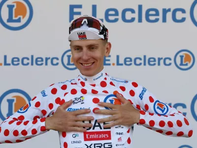 Cycling - Tour de France - Stage 1 - Barcelona to Barcelona - Barcelona, Spain - July 4, 2026 UAE Team Emirates XRG's Tadej Pogacar celebrates on the podium wearing the polka-dot jersey after stage 1 REUTERS/Gonzalo Fuentes