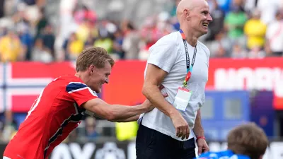 Norway's Martin Oedegaard (10) jokes with Norway head coach Stale Solbakken after the World Cup round of 16 soccer match between Brazil and Norway in East Rutherford, N.J., near New York, Sunday, July 5, 2026. (AP Photo/Frank Franklin II)