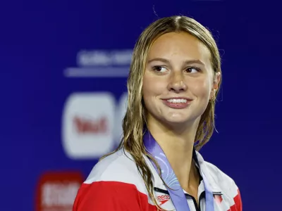 FILE PHOTO: Canada's Summer McIntosh celebrates after winning the Women's 400m Medley Final in the World Aquatics Championships in Singapore in August 2025. REUTERS/Tingshu Wang/File Photo
