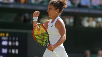 Jasmine Paolini of Italy celebrates winning the women's singles fourth round match against Alexandra Eala of the Philippines at the Wimbledon Tennis Championships in London, Monday, July 6, 2026.(AP Photo/Kirsty Wigglesworth)